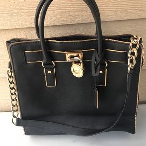 Black Michael Kors Purse With Lock and Key